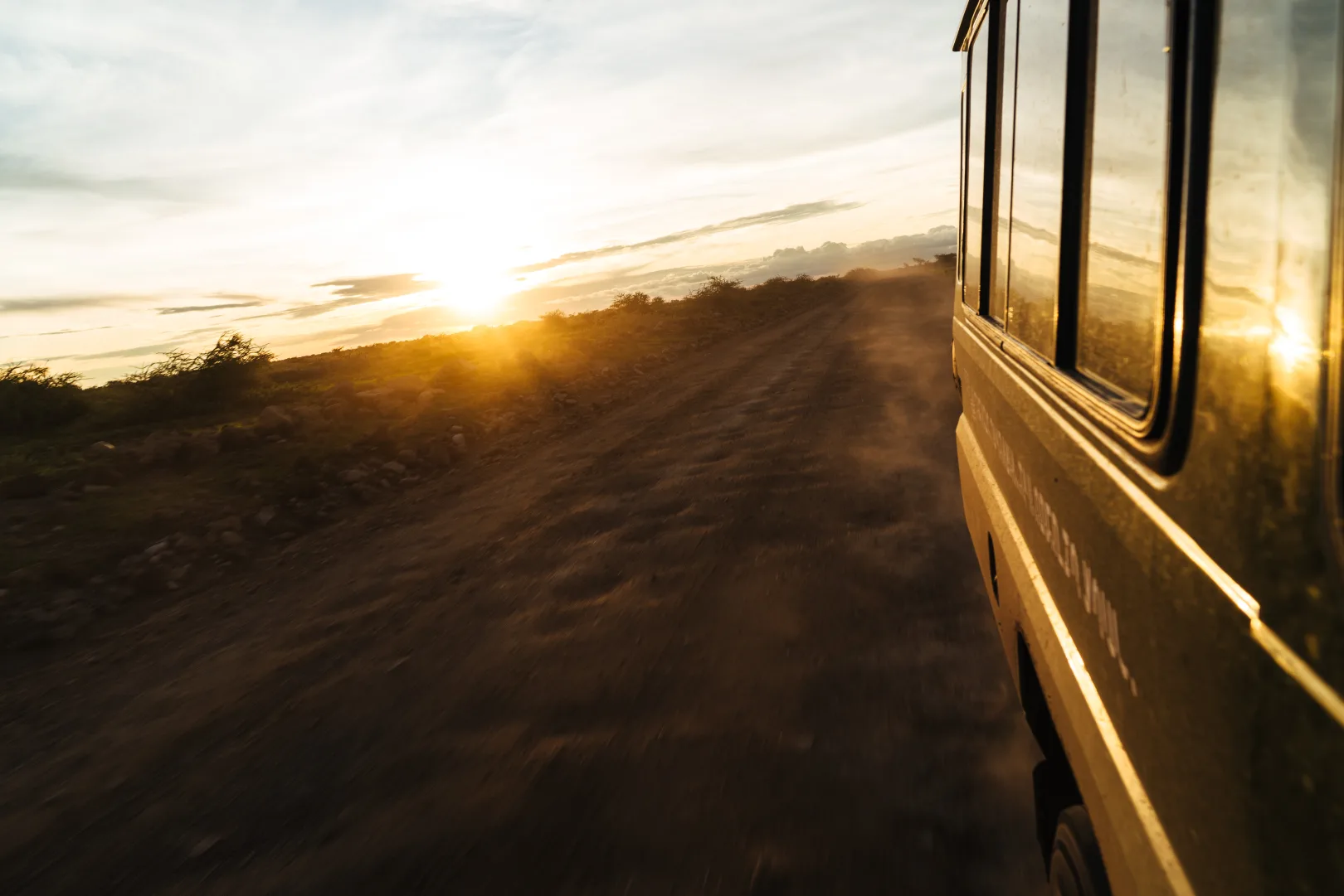 Private luxury safari vehicle at sunset in the Tanzanian bush